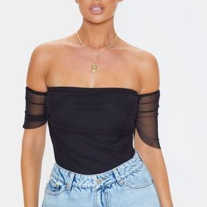 Black body suit with mesh sleeves